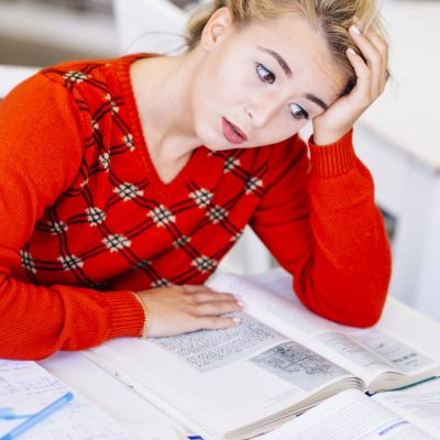 young-woman-studying-exam-scaled.jpg